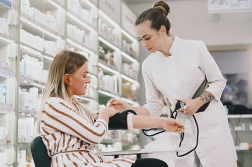 women checking blood pressure