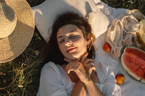 women Take Time For herself laying in nature