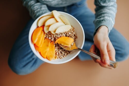 women eat healthy breakfast